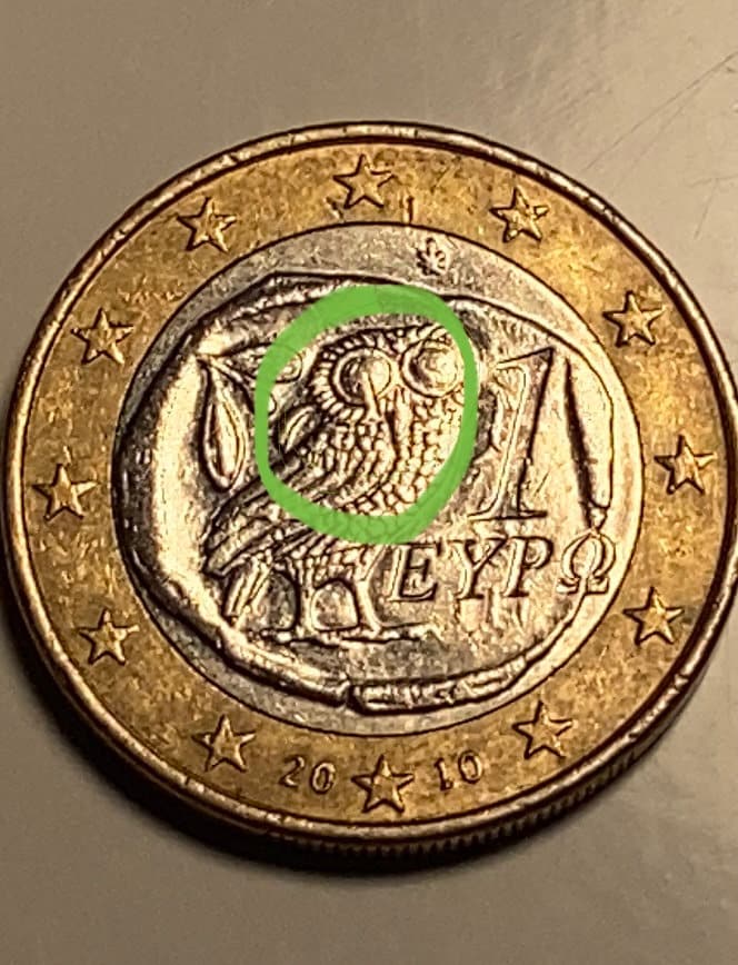 Currency 1 Euro Owl Greece 2010. Huge typo in the right eye of the owl  appears a 1.