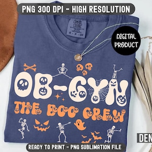 May include: A navy blue t-shirt with the text "OB-GYN The Boo Crew" in orange and white. The design includes Halloween-themed graphics such as skulls, pumpkins, skeletons, and a ghost. The shirt is a digital product.