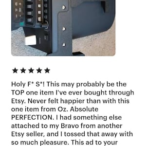 May include: Close-up of a black electronic device with multiple buttons and switches. The device has a complex design with various panels and a textured surface. The image includes a customer review with a five-star rating.
