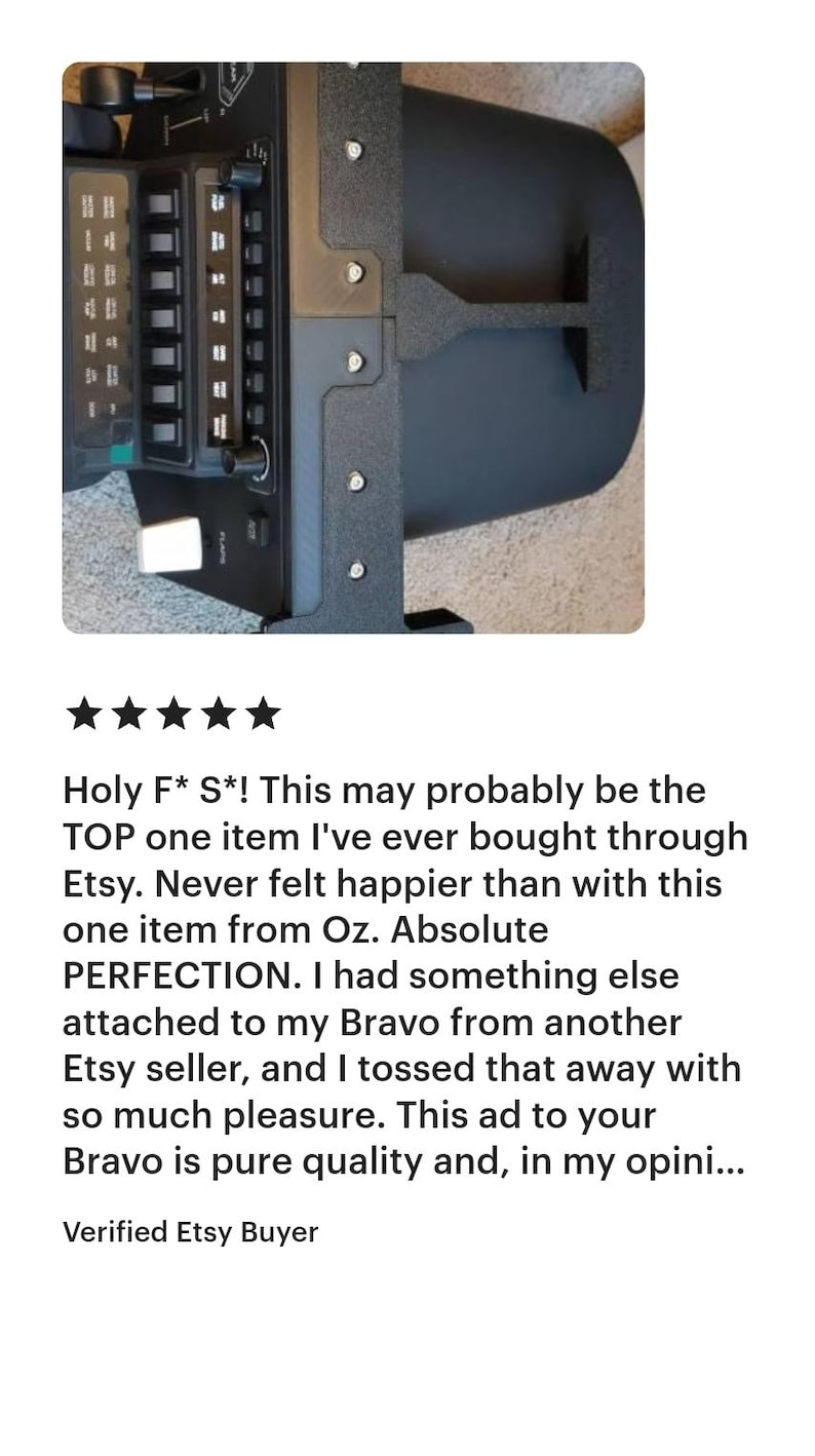 May include: Close-up of a black electronic device with multiple buttons and switches. The device has a complex design with various panels and a textured surface. The image includes a customer review with a five-star rating.