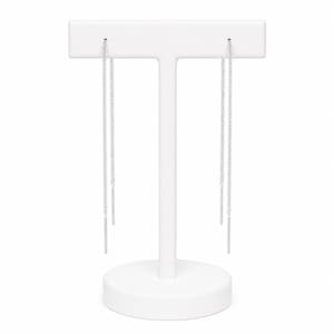 May include: A pair of silver threader earrings displayed on a white jewelry stand. Each earring features a delicate chain with a small, rectangular bar at the end. The earrings are shown against a plain white background.