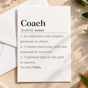 May include: A white rectangular card featuring a dictionary-style definition of the word Coach. The text includes the phonetic spelling, the noun classification, and three numbered definitions describing a motivator and guide, ending with See also: Chris.