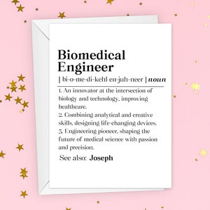 May include: A white card with a black and white definition of a biomedical engineer. The definition includes the pronunciation of the word and a description of the profession. The card has a gold star pattern on a pink background.