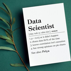 May include: A white rectangular card featuring black text that defines the term Data Scientist with a phonetic pronunciation, a noun label, and four numbered points, including references to p-values, data cleaning, and pie charts.