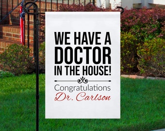 Personalized Doctor Graduation Garden Flag, We Have A Doctor In The House Yard Flag, Graduation Gifts, Medical School Graduation Yard Gifts