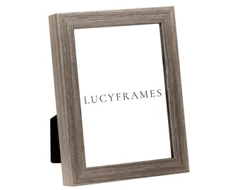 May include: A gray wood picture frame with a white mat and the text "LUCYFRAMES" printed on the mat.