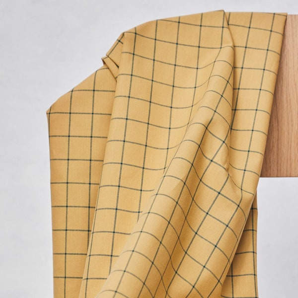 organic checked cotton oxford in mustard with green check, 140 gr/m2 cut to length. Sold by units of 10 cm (1 mt= 10 units)