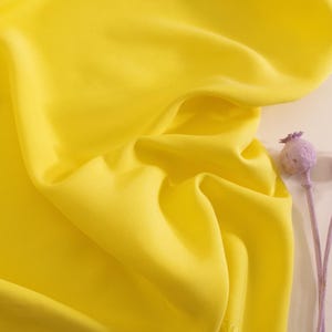 tencel twill in lemon, cut to length. Designer deadstock fabric sold by units of 10 cm (1 mt= 10 units)