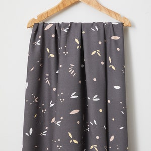 sustainable ECOVERO™ Viscose crepe in calm grey with petals print, 170 gr/m2 cut to length. Sold by units of 10 cm (1 mt= 10 units)