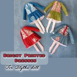 May include: Four brightly colored, printed dresses for Blythe dolls. Each dress features long sleeves, a skirt, and striped legs. The dresses are in shades of blue, green, and red, with floral and geometric patterns. The text "BRIGHT PRINTED DRESSES For Blythe doll" is at the bottom.