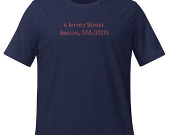 May include: A navy blue t-shirt with the text "4 Jersey Street Boston, MA 02215" printed in red on the front.