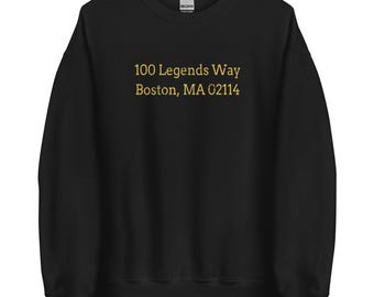 May include: Black sweatshirt with gold lettering that reads "100 Legends Way Boston, MA 02114"