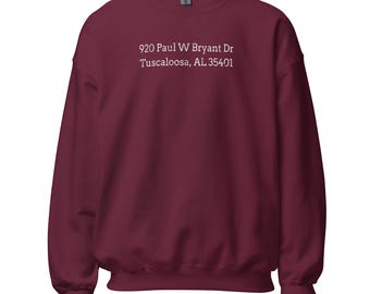 May include: Burgundy sweatshirt with white text that reads "920 Paul W Bryant Dr Tuscaloosa, AL 35401"