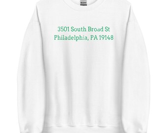 May include: White sweatshirt with the text "3501 South Broad St Philadelphia, PA 19148" printed in green. The sweatshirt is a crew neck style.