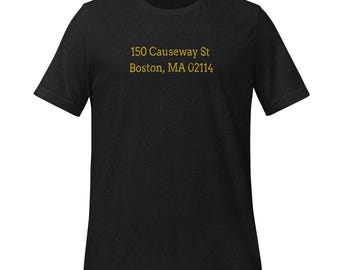 May include: Black t-shirt with the text "150 Causeway St Boston, MA 02114" printed in gold.
