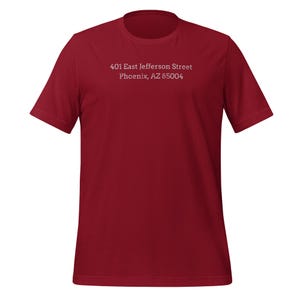 May include: A red t-shirt with white text that reads "401 East Jefferson Street Phoenix, AZ 85004"