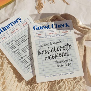 May include: Two white paper cards with blue text and grid lines. One reads "Itinerary" and the other "Guest Check." The Guest Check says "welcome to alexa's bachelorette weekend celebrating the bride to be."