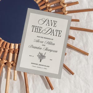 May include: A wedding "Save the Date" card with a striped border and elegant script. The card features the names Alexa Milton and Brandon Thompson, the date November 15, 2025, and the location Newport, Rhode Island.