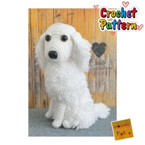 May include: A handmade white crochet dog with brown eyes and a black nose. The dog is sitting upright with its fluffy tail behind it. The image includes a sticker that says "Crochet Pattern".