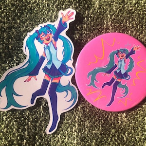 May include: A sticker and a button featuring a cartoon character with long teal pigtails, a blue and white outfit, and knee-high socks. The button is pink with yellow lightning bolt accents.