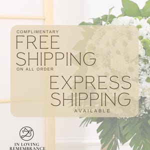 May include: A floral arrangement with white and green flowers, and green leaves. The image includes text that reads "COMPLIMENTARY FREE SHIPPING ON ALL ORDER EXPRESS SHIPPING AVAILABLE" and "IN LOVING REMEMBRANCE".