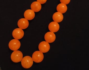 orange colored 60s 70s necklace beads
