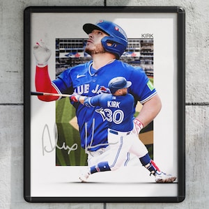 May include: Framed print featuring a baseball player in a blue uniform with the text "BLUE JAYS" and the name "KIRK" on the back. The player is wearing a blue helmet and holding a bat. The image has an autograph.