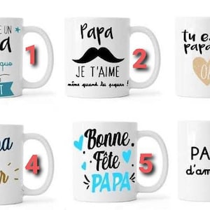 Peut inclure: Six tasses en céramique blanche avec des designs et des textes différents. Les tasses présentent des phrases comme "Papa", "Je t'aime", "Tu es un papa en or", "Bonne Fête Papa", et "Papa d'amour".