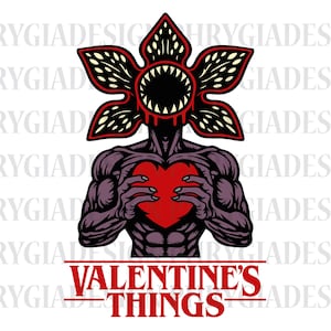 May include: A graphic illustration featuring a Demogorgon-like creature holding a red heart. The creature has a flower-like head and muscular physique. The text "VALENTINE'S THINGS" is at the bottom in red.