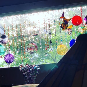 Sun catchers, rainbow makers prisms, crystals and glass beads. Boho decor, window curtains.