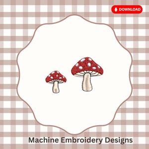 May include: A machine embroidery design featuring two mushrooms with red caps, white spots, and cream-colored stems. The mushrooms are positioned side-by-side, with the larger one on the right and the smaller one on the left, showcasing detailed stitching.