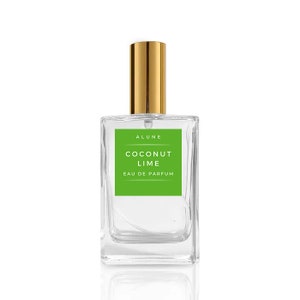 May include: A clear glass bottle of coconut lime perfume with a gold spray nozzle and a green label that reads "ALUNE COCONUT LIME EAU DE PARFUM".