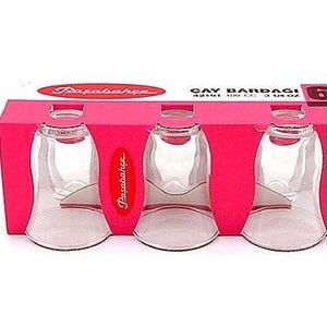 May include: A set of six clear glass teacups in a pink and white box. The box says "ÇAY BARDAGI 6 420 ml 14.2 fl oz" and "PAZABAHCE".