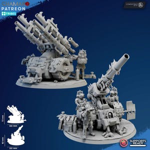 Puede incluir: Dos máquinas de guerra en miniatura grises con diseños detallados. Una presenta múltiples lanzacohetes, mientras que la otra tiene un cañón grande. Ambas incluyen figuras en miniatura y están sobre bases circulares. La imagen también incluye el texto "SUPPORTS READY".