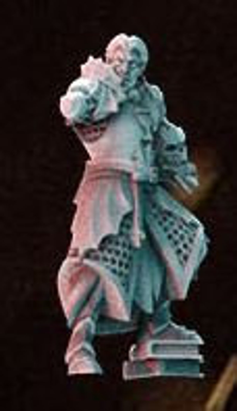 May include: A miniature figurine of a man wearing a long, flowing robe with a detailed pattern. He is holding a book in his left hand and a staff in his right hand. The figurine is painted in shades of blue and green, with a hint of pink on the robe. The figurine is standing on a base of books.