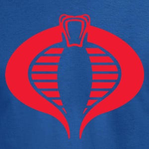 May include: A blue t-shirt featuring a large red Cobra logo. The logo is a stylized cobra head with a forked tongue, enclosed within an oval shape. The shirt is made of a soft material.