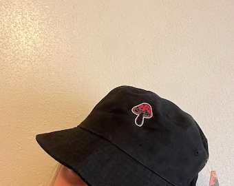 Pink Mushroom embroidered on a Black Bucket Hat
