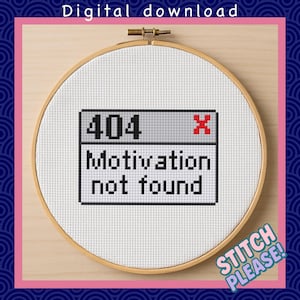 May include: A cross-stitch embroidery hoop with the text "404 Motivation not found" in a pixelated computer window design. The hoop is set against a light wood background, with the words "Digital download" and "Stitch Please!" also visible.