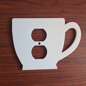 Coffee cup shaped outlet cover