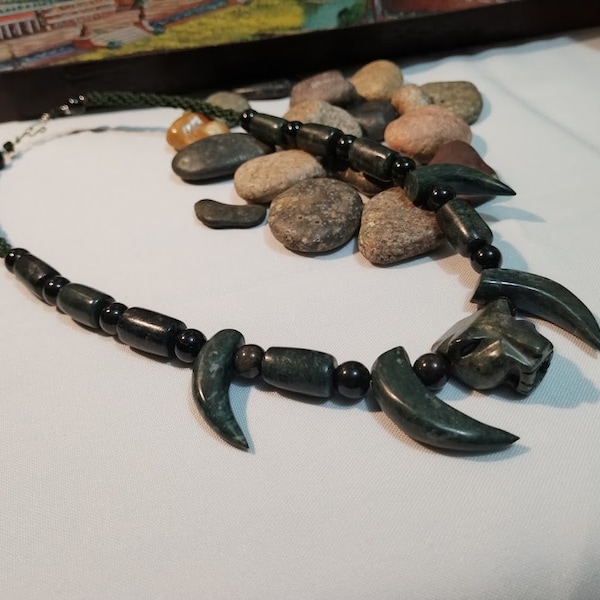 Jade necklace with jaguar head and fangs