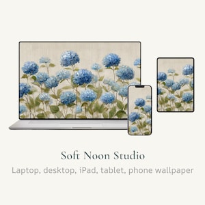 May include: A laptop, phone, and tablet display a floral wallpaper design featuring blue hydrangea blooms. The background is a neutral beige, and the overall aesthetic is soft and elegant. The text "Soft Noon Studio" is visible.