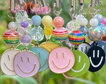 Ciondoli per telefono con faccina sorridente / Ciondoli per borsa con faccina sorridente / Portachiavi con faccina sorridente / Accessori per telefono / Accessori con ciondoli per borsa