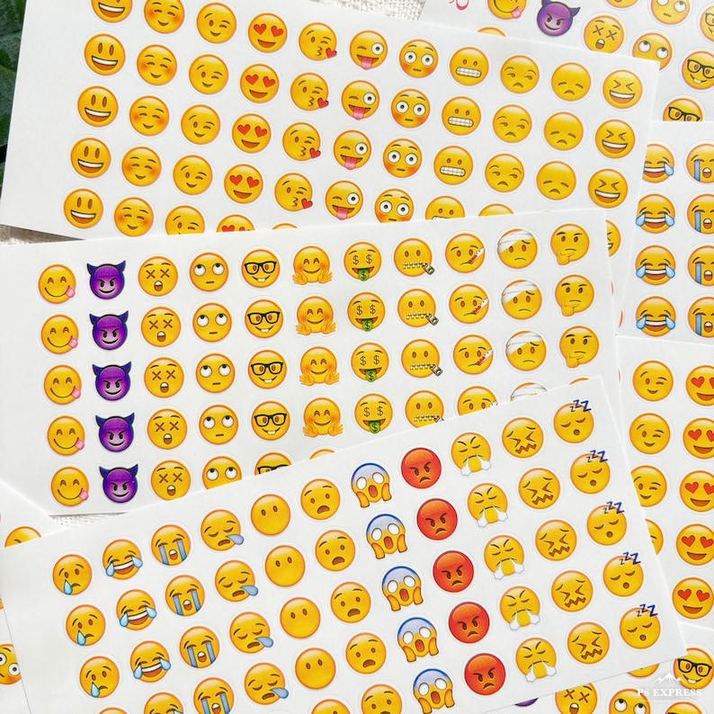 May include: A sheet of colorful emoji stickers with various expressions, including happy, sad, angry, and surprised. The stickers are arranged in rows and columns on a white background.