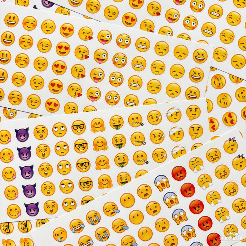 May include: A sheet of colorful emoji stickers with various expressions, including happy, sad, surprised, and angry. The stickers are arranged in rows and columns, and some are overlapping.