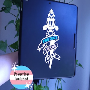 May include: Black iPad case with a white sticker of a dagger with a banner that reads "Protect Trans Kids". The sticker is in a white, blue, and pink color scheme. A pink, blue, and white transgender pride flag with the text "Donation Included" is in the lower left corner of the image.