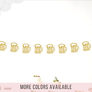 May include: Gold glitter beer mug banner with eight mugs. The banner is strung on a white string. The banner says "More Colors Available" at the bottom.