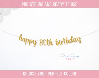 May include: Gold glitter banner that reads "happy 80th birthday". The banner is pre-strung and ready to use.