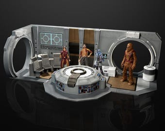 May include: A Star Wars action figure playset featuring a detailed interior cockpit with a central console, two chairs, and wall panels. Four figures are positioned within the structure, including a Wookiee, a blue-skinned character, and two others.