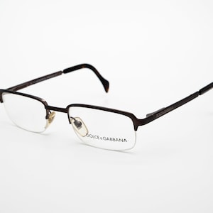 Dolce & Gabbana vintageglasögon, rektangulära halvbågade optiska bågar tillverkade i Italien, nya gamla lager