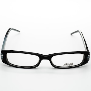 May include: Black rectangular eyeglasses with silver accents on the arms and a silver logo that reads "4US Cesare Paciotti" on the right lens.